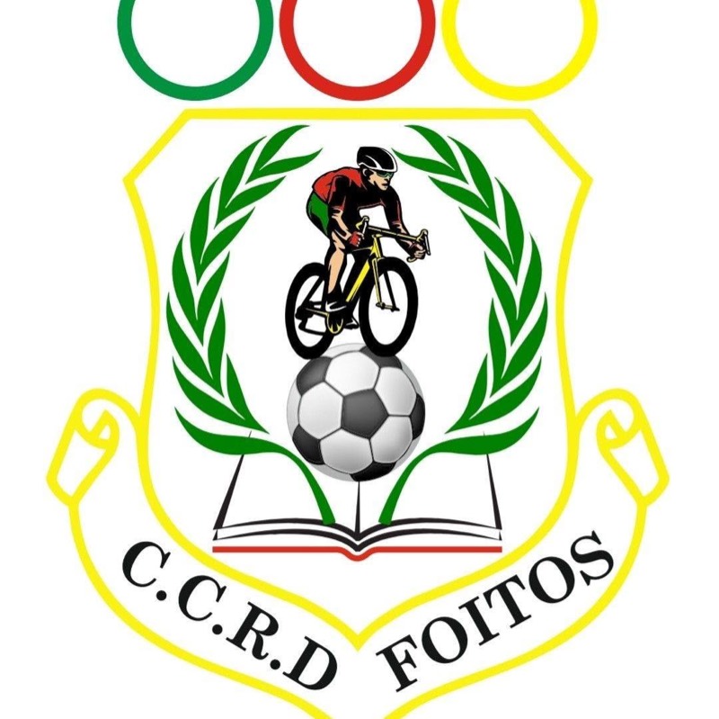 Emblema do Centro Cultural, Recreativo e Desportivo de Foitos: um escudo de contorno amarelo com um ciclista sobre uma bola de futebol e um livro aberto, entre dois ramos de louro verdes. Em baixo, numa fita, a sigla C.C.R.D. Foitos; em cima, três argolas verde, vermelha e amarela.
